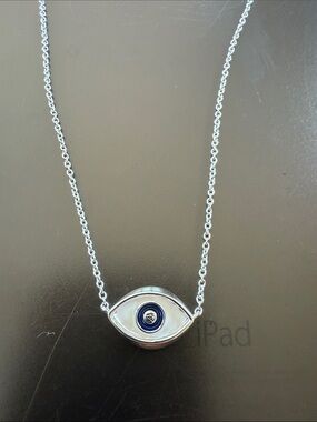 Sterling silver sand filled evil eye necklace